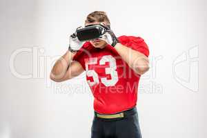 Football player in virtual reality headset