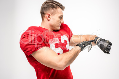 Football player pointing on smartwatch