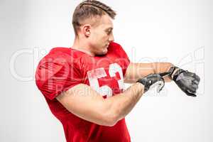 Football player pointing on smartwatch