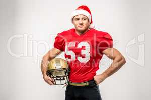 Football player in santa hat