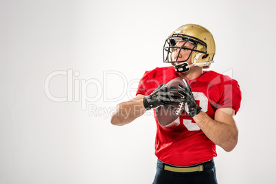 Football player holding ball