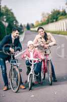 Happy family with bicycles