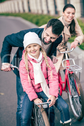 Happy family with bicycles