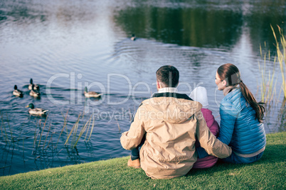 Family looking at lake with ducks