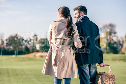 Happy couple with picnic basket