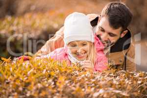 Little girl playing with father in park