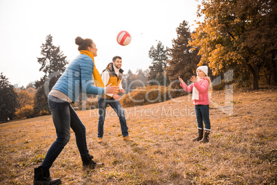 Happy family playing in park