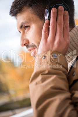 Handsome young man in earphones