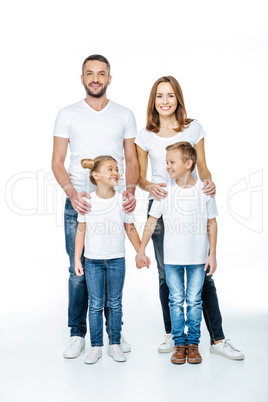 Smiling family in white t-shirts