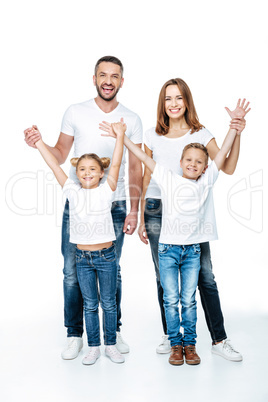 Happy family with raised hands