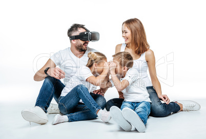 Man in virtual reality headset with family