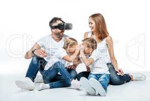 Man in virtual reality headset with family