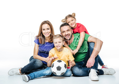 Happy family with soccer ball