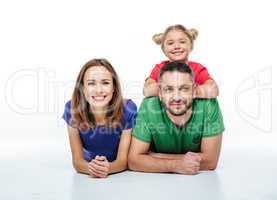 Smiling parents with cute little daughter