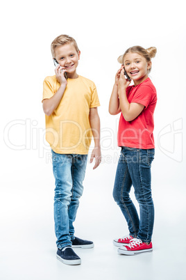 Kids talking on mobile phones