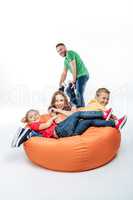 Family having fun in sack-chair