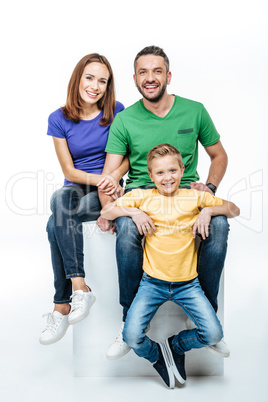 Family sitting and looking at camera