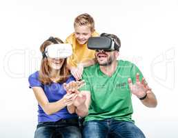 Family using virtual reality headsets
