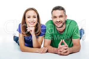 Couple lying and looking at camera
