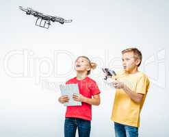 Kids using digital tablet and hexacopter drone