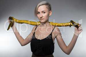 Woman stretching yellow snake