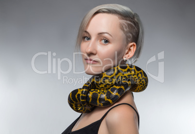 Woman with yellow snake on her neck