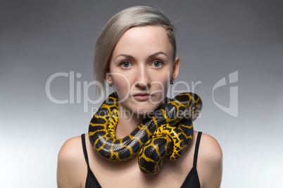 Woman with snake on her neck