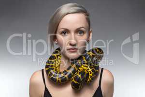 Woman with snake on her neck