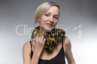 Blond woman and strangling snake