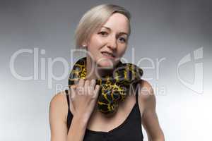 Blond woman and strangling snake