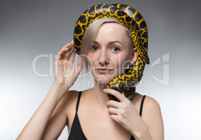 Blond woman and snake on her head
