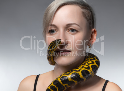 Blond woman and crawling snake