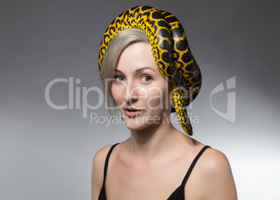 Woman and snake on her head