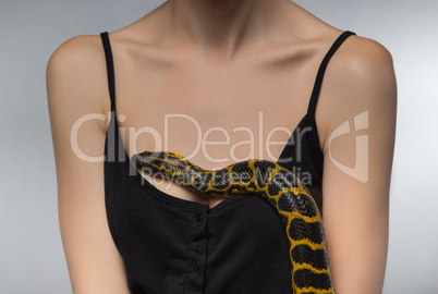 Woman and snake on her breast