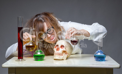 Mixing liquid scientist with human skull