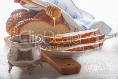 Braided Challah bread and honey