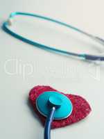 Red heart shape with stethoscope