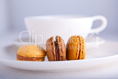 Almond cookies French macaroons with a cup of tea