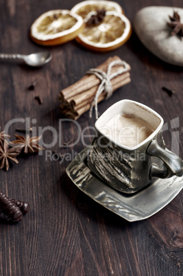 Coffee cup with dry citrus and star anise