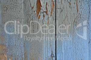 Wooden blue surface with cracks and scuffs