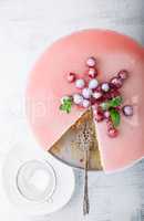 Raspberry yogurt cake with berries on a table.