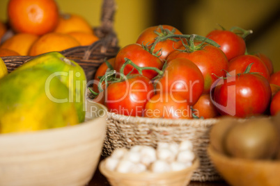 Juicy tomatoes and fruits in organic section