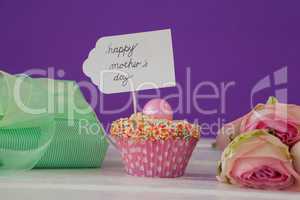 Happy mothers day card on cup cake