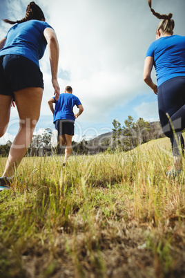 Fit people running in bootcamp