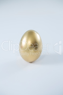 Golden Easter egg on white background