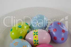 Painted Easter eggs arranged in plate