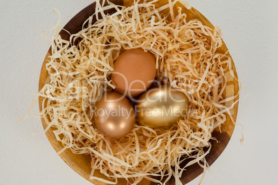 Golden easter eggs in bowl