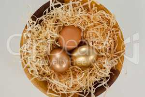 Golden easter eggs in bowl