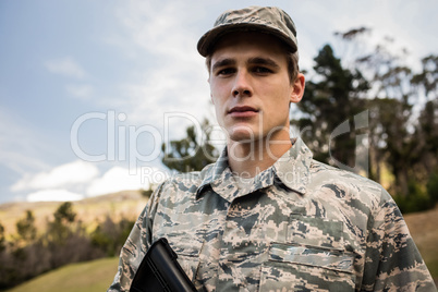 Portrait of military soldier guarding with a rifle