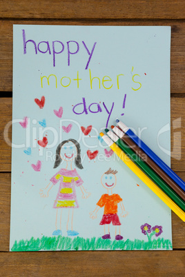 Happy mothers day greeting card on wooden background